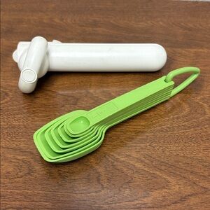 Vintage Tupperware green measuring spoons set and can opener